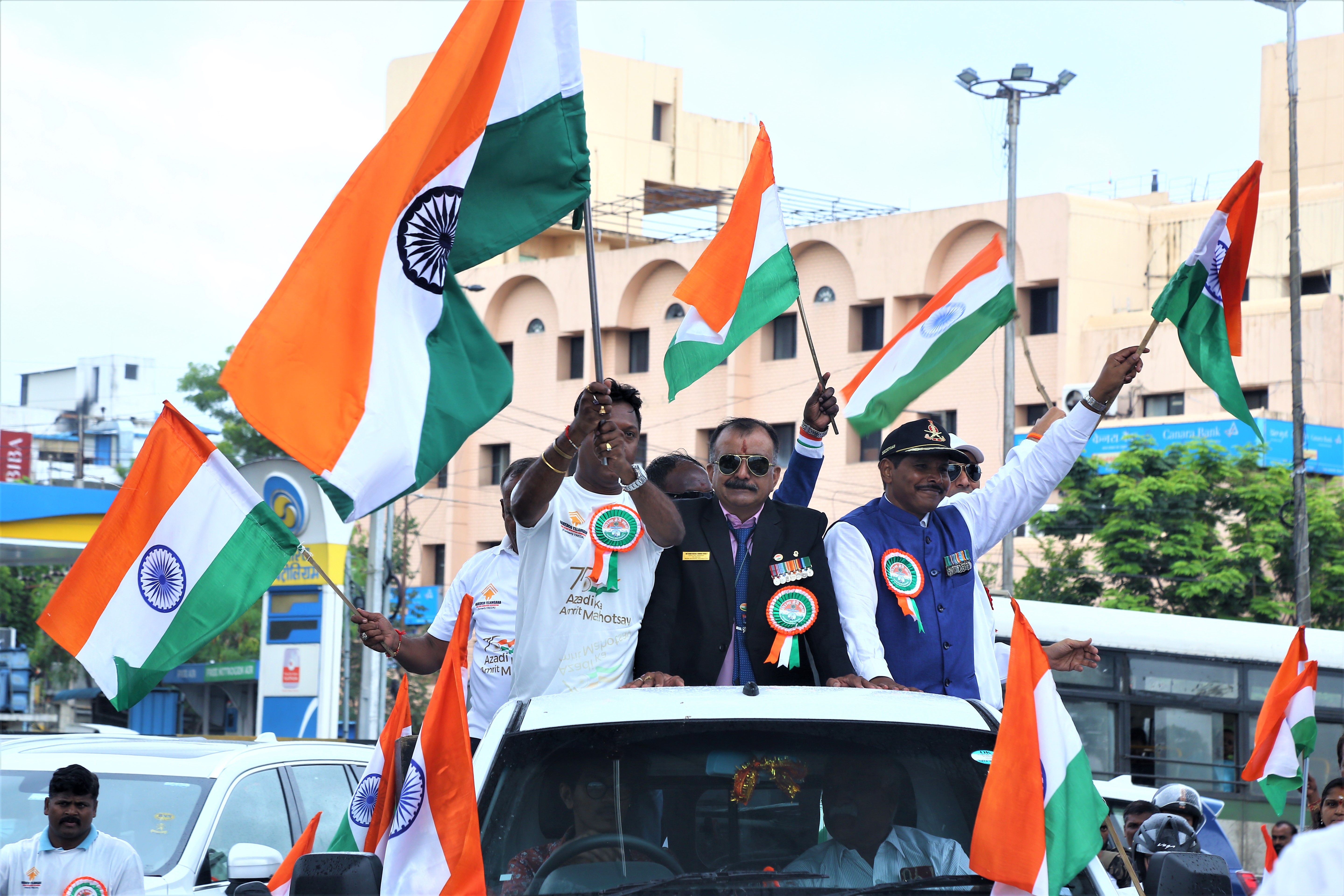 Veterans waving Indian flags during the bike rally